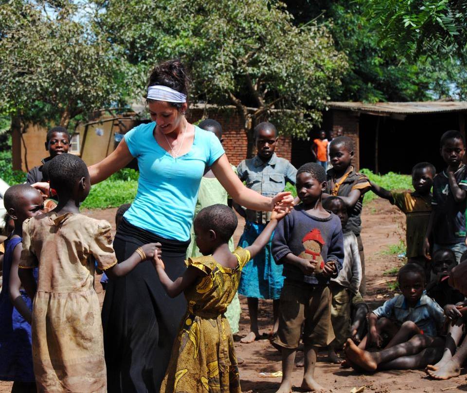 Amber Haubert, the owner of Global Coffee Co. with residents in Malawi, Africa during a four-month mission trip in 2013.