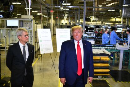 US President Donald Trump (r) and Apple CEO Tim Cook speak to the press during a tour of the Flextronics computer manufacturing facility where Apple's Mac Pros are assembled in Austin, Texas, on November 20, 2019. (MANDEL NGAN/AFP via Getty Images)