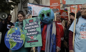 Campaigners against plans to expand Heathrow airport through the construction of a third runway protest outside the royal courts of justice on 17 October.
