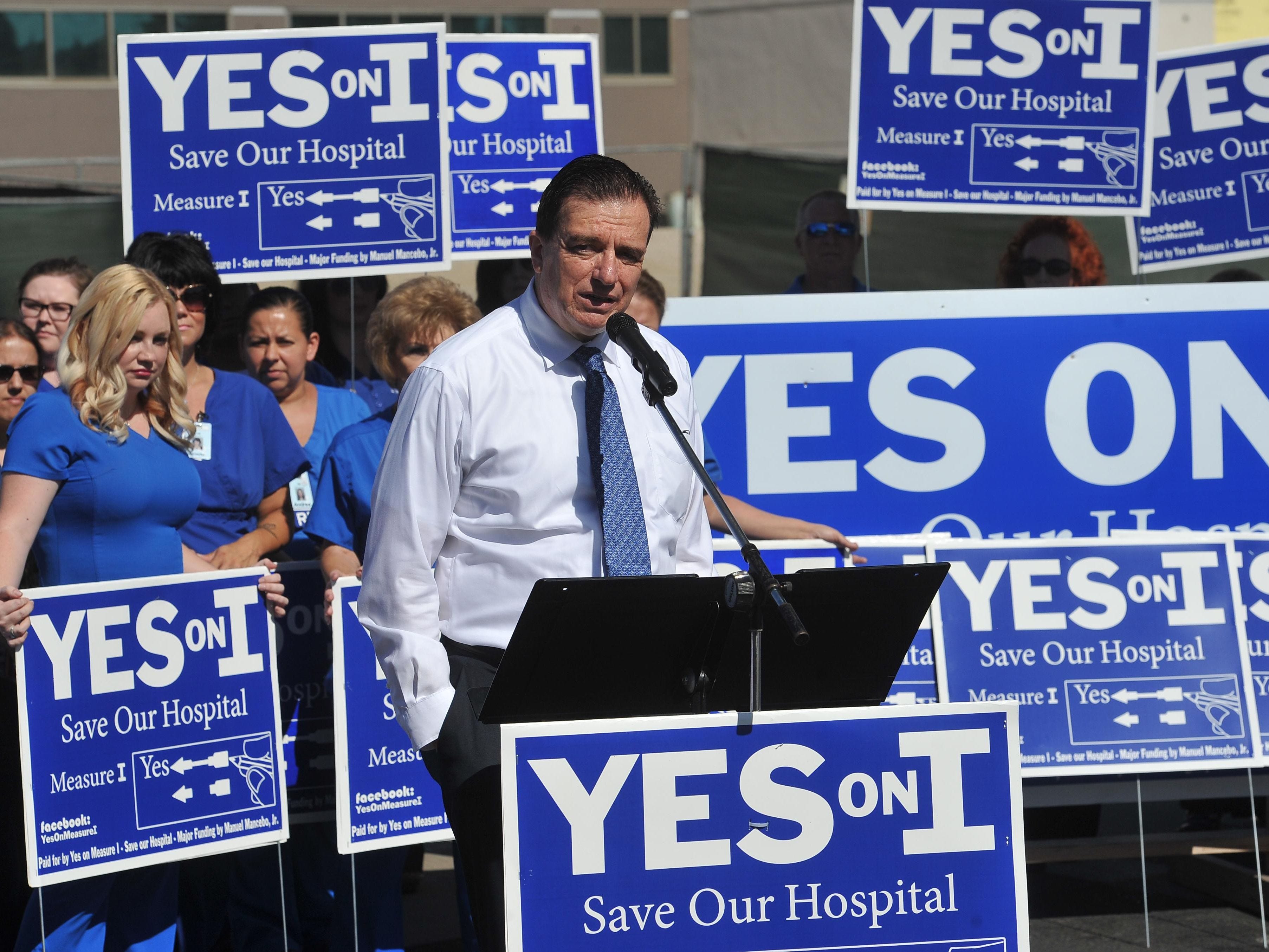 Dr. Benny Benzeevi speaks during the Yes on Measure I Save Our Hospital press conference in front of the Tulare Regional Medical Center tower on July 12, 2016.