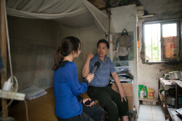 Li Xiangjun lives in a tiny room to keep expenses low. He is saving for medical emergencies because people in China can still go bankrupt from a major illness. (Credit: Shanghai 808 Studio)