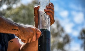 Dr Michael Fletcher cuts one of the cores with a knife
