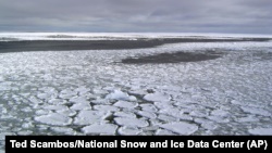 his January 2017 photo provided by Ted Scambos shows sea ice on the ocean surrounding Antarctica during an expedition to the Ross Sea.