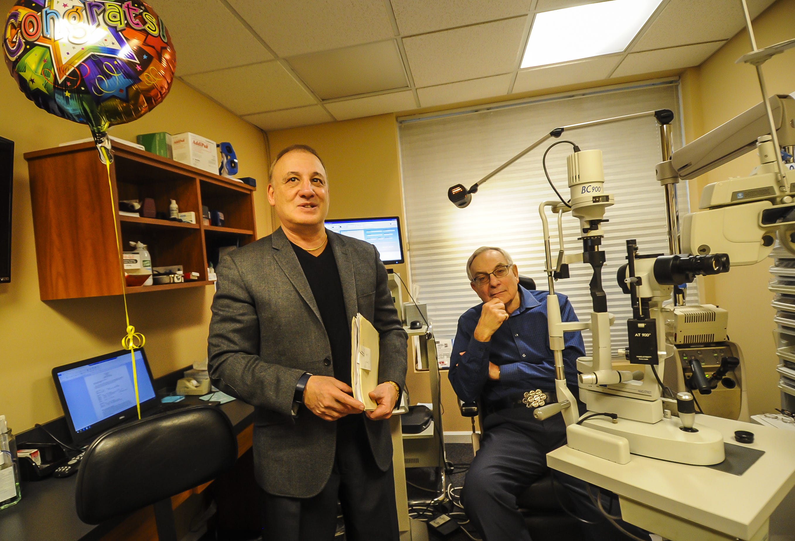 Optometrist Eye Doctor Steve Silberberg of Matawan, who is retiring after 40 years, with Ed DeNoble of Ocean, his last patient and who was also his first patient 40 years ago at his office in Matawan on Dec. 28, 2019.