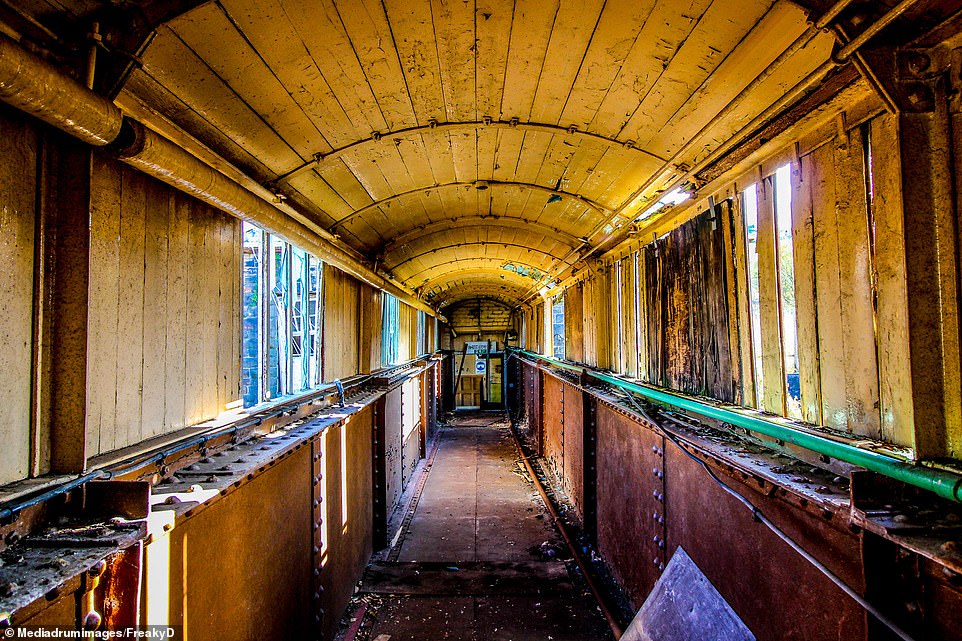 The photographer referred to this section of the factory as the 'death bridge' as he passed through the rusty tunnel to investigate other parts of the site