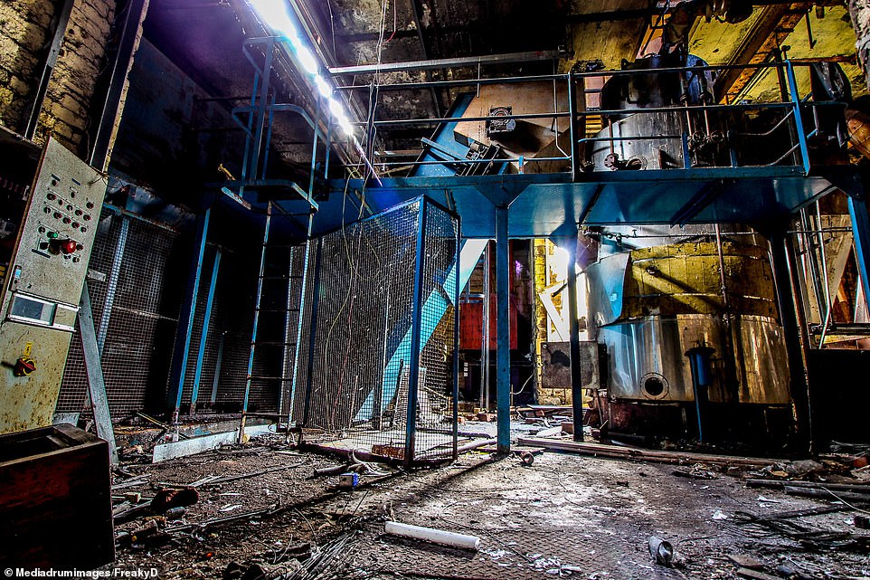 Faded control panels and a collapsed ceiling are seen in the factory which was once producing parts for Russian submarines during the Second World War to help counter the U-boat threat