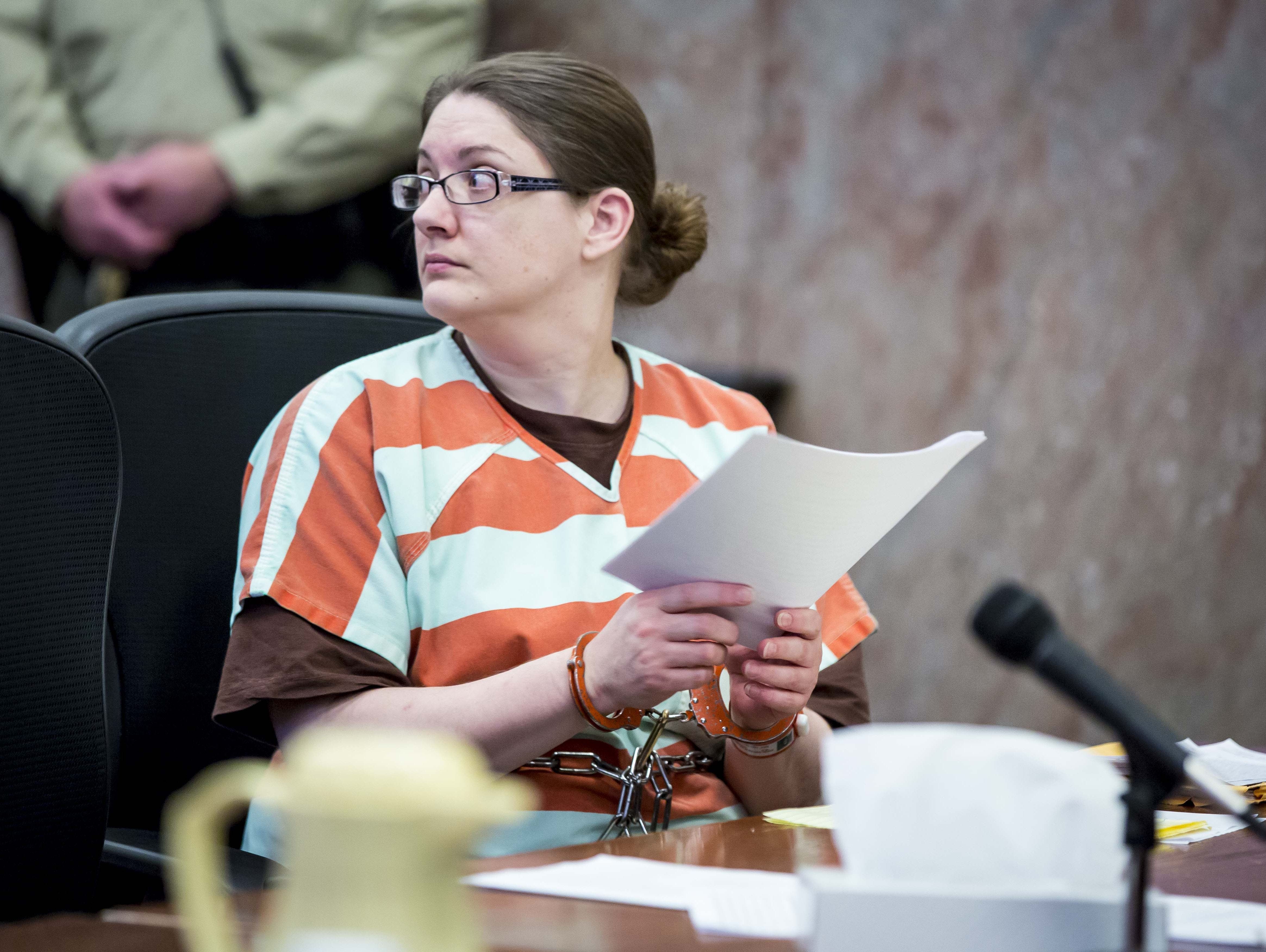 Nicole Finn looks back at her relatives during her January 2018 sentencing at the Polk County Courthouse. Finn, 43, was convicted in December of first-degree murder in the death of 16-year-old adopted daughter Natalie and two counts of kidnapping for confining Natalie's siblings Jaden, 15, and Mikayla, 14.