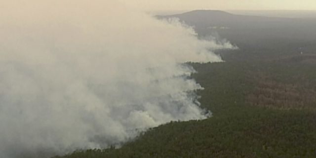 In this image made from video, an aerial view shows wildfires in the forests of Gippsland, Victoria, Australia, Dec. 31, 2019.