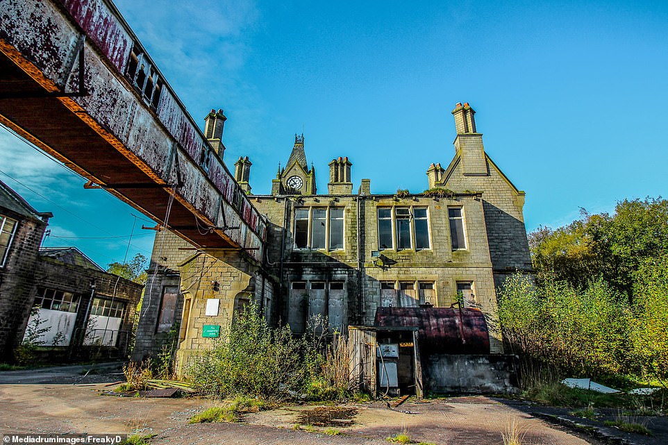 The Grade II listed clock tower known locally as 'The Cathedral' which forms the derelict factory on the 22-acre site in Diggle, Greater Manchester