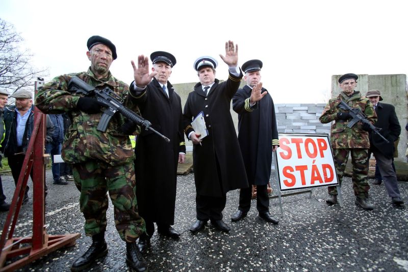 Members of the anti-Brexit campaign group Border Communities Against Brexit, dressed up as British Army Soldiers and Customs officials, pose with a wall installed on a road crossing the border between Northern Ireland and Ireland, during a demonstration in Newry, Northern Ireland, on Jan. 26.