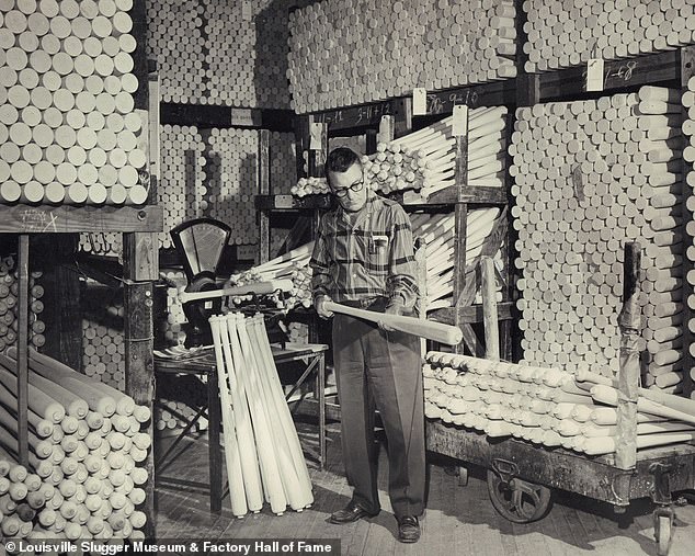 Employee Bill Lesch inspecting rough-turned timber. 17-year-old,John "Bud" Hillerich began making baseball bats in the 1880s after watching Louisville's major league team star player, Pete "Louisville Slugger" Browning break his bat during a game