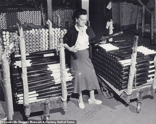 Employee inspecting bats before they’re shipped out. January 15, 1958