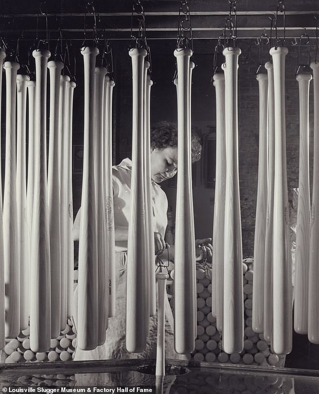 Unnamed employee is pictured dipping bats. Recalling post-war America, Laura Quiggins told DailyMail.com: ‘That was the place to work, back in the day. It was General Electric, Ford and Hillerich and Bradsby'