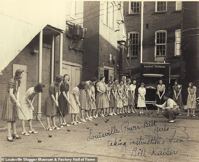 Bill Kaiser giving a golf lesson to the 'Louisville Power-Bilt girls' in an undated photo