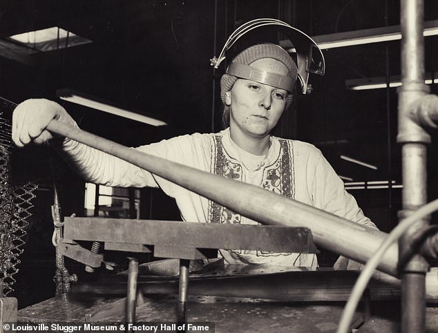 An unidentified employee works on a metal bat at the Los Angeles, California factory