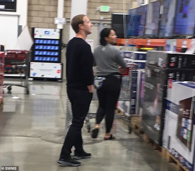 The photo shows Zuckerberg and Chan in the TV aisle of the Costco location in Mountain View