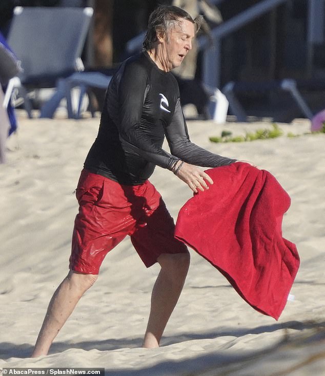 Favourite colour? The Beatles legend has been keen on his swimming sessions during his getaway at the popular island, where temperatures reached 86 degrees Fahrenheit this week