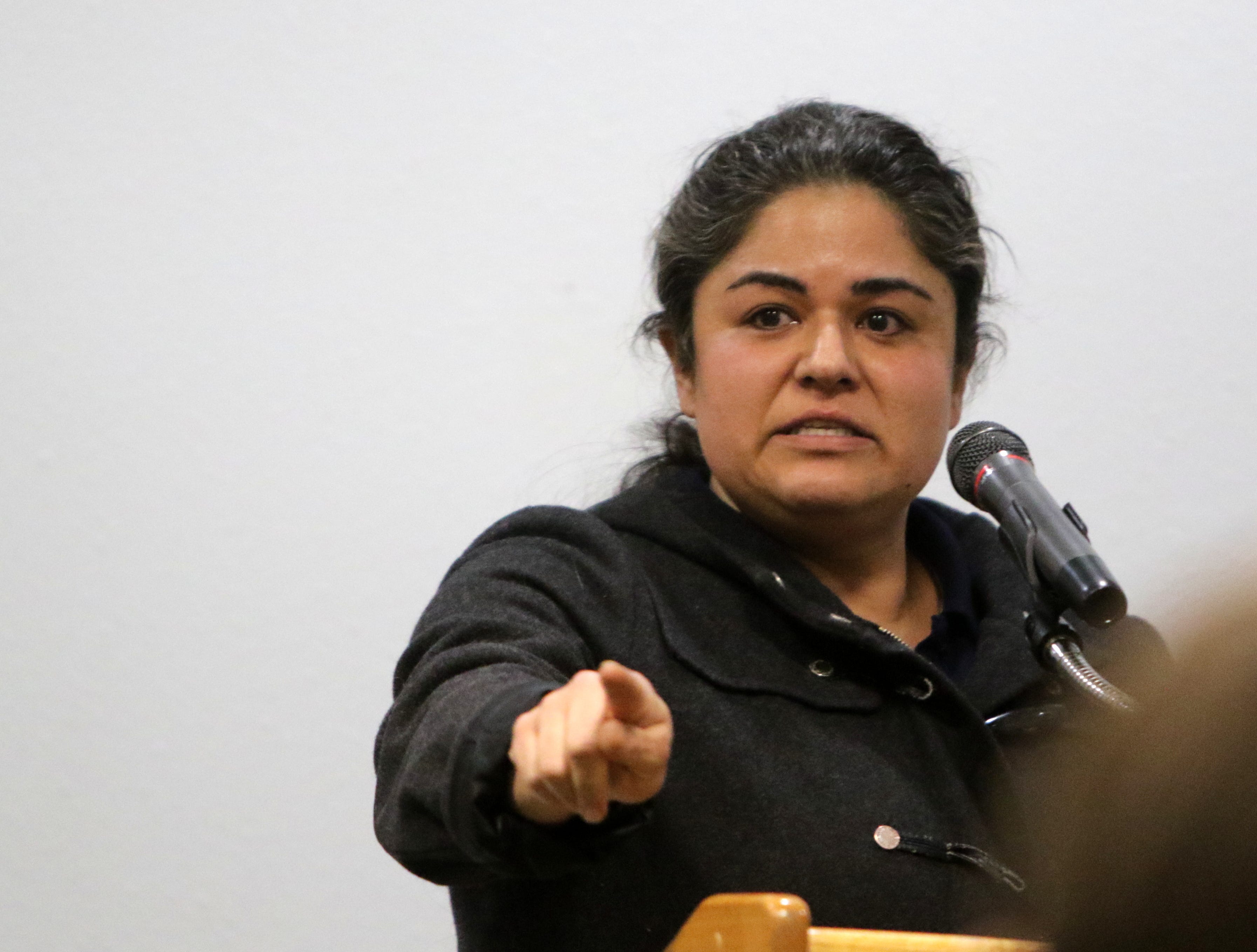 PNM employee Geneva Griego speaks, Monday, Jan. 6, 2020, during a public hearing hosted by the New Mexico Public Regulation Commission at San Juan College regarding the future of the San Juan Generating Station.