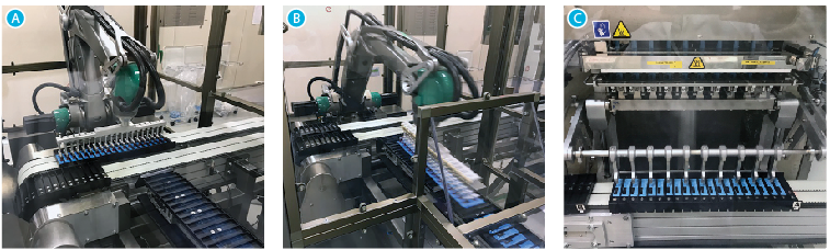 A robotic device picks 20 stick packs from a shuttle (A) and, after turning them 90 deg, places them into a flighted takeaway conveyor (B). A short distance downstream, a second robotic pick-and-place unit (C) picks stick packs from the flighted takeaway conveyor and places them in a bucket conveyor that leads to the cartoner.