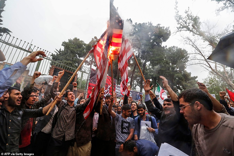 These protesters gathered in May 2018 after US President Donald Trump announced he was pulling out of the Iranian nuclear deal, which caused anger on the streets of Tehran, prompting people to gather outside the former US Embassy to burn a few flags