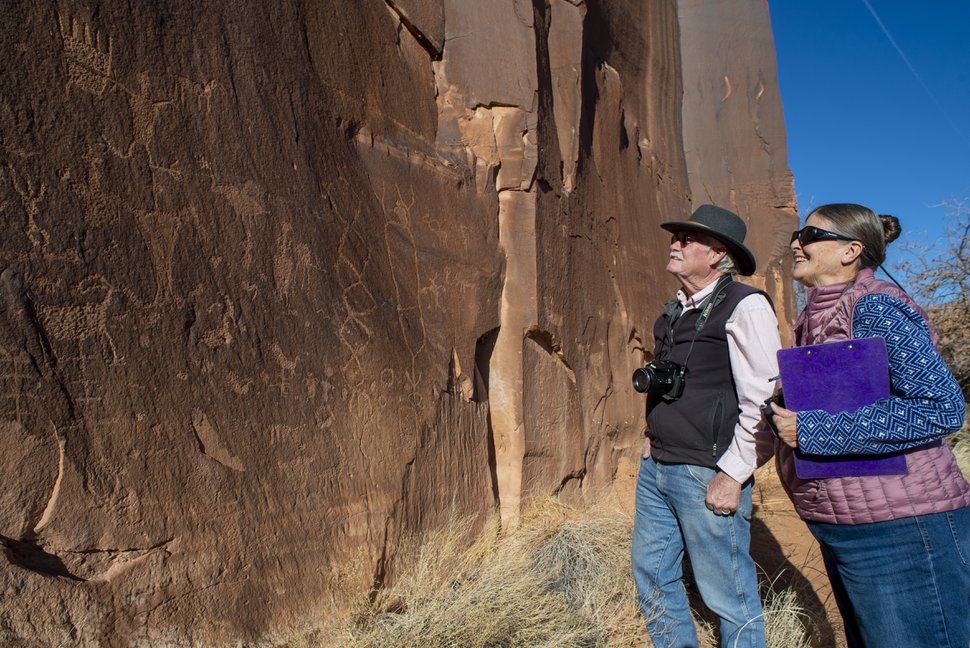 (Rick Egan | The Salt Lake Tribune) Volunteers Pam and Quentin Baker observe some rock art along Potash Road near Moab. The Bakers are leading a 20-year effort to document 199 rock art sites. Wednesday, Jan. 15, 2020. 