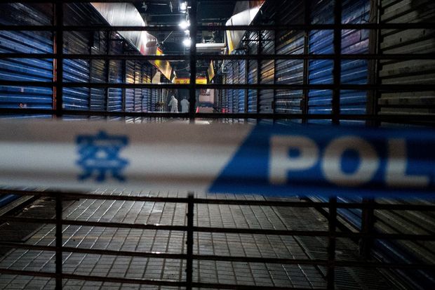 Wuhan emergency health workers conducted searches on Wuhan’s closed Huanan Seafood Wholesale market on Jan....