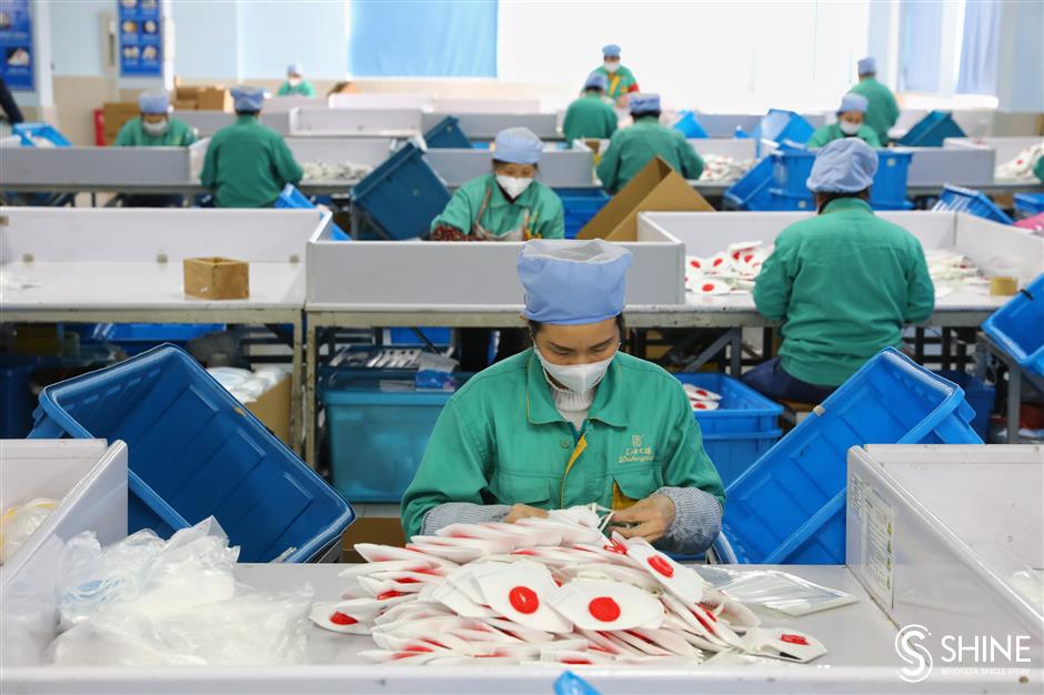 Shanghai mask factory scrambles to meet demand