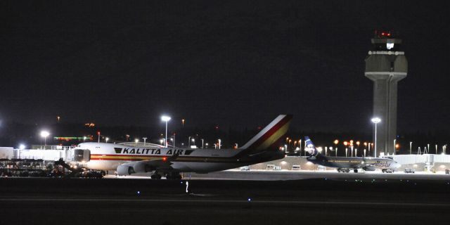 The aircraft carrying hundreds of American diplomats and citizens, sitting on the tarmac of Ted Stevens Anchorage International Airport in Anchorage, Alaska, on Tuesday.