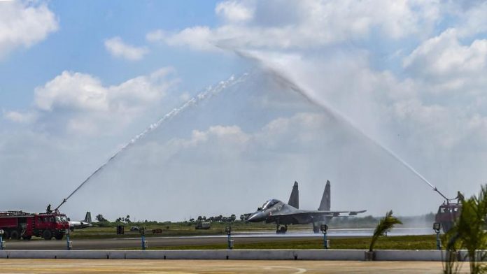 Sukhoi-30MKI fighter aircraft squadron being accorded water salute during its induction ceremony into the Indian Air Force at the Thanjavur airbase.