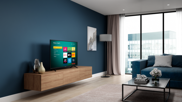 A Roku-powered TV in the living room of an apartment