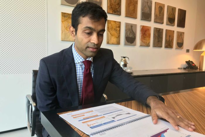 Siddharth Parameswaran, an insurance analyst with JP Morgan, sits looking at a chart.