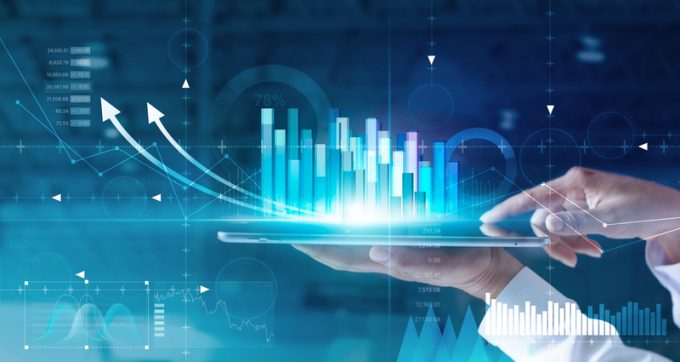 Hands of businessman analyzing sales data and economic growth gr