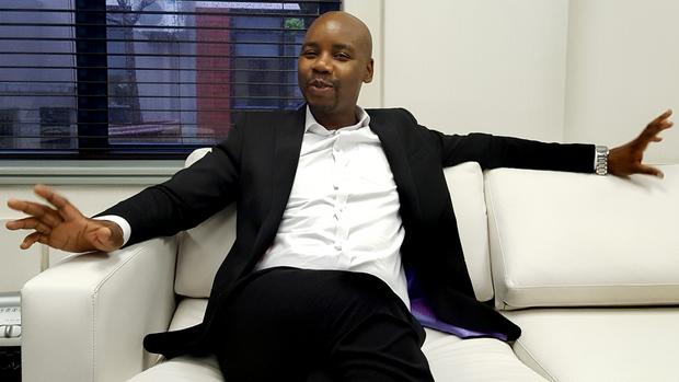 Proudly SA chief executive Eustace Mashimbye on a locally produced couch in his office in Rosebank, Johannesburg. Photo: Philippa Larkin
