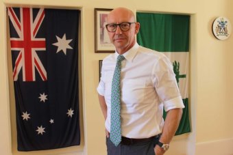 Portrait photo of Norfolk Island administrator Eric Hutchinson. 