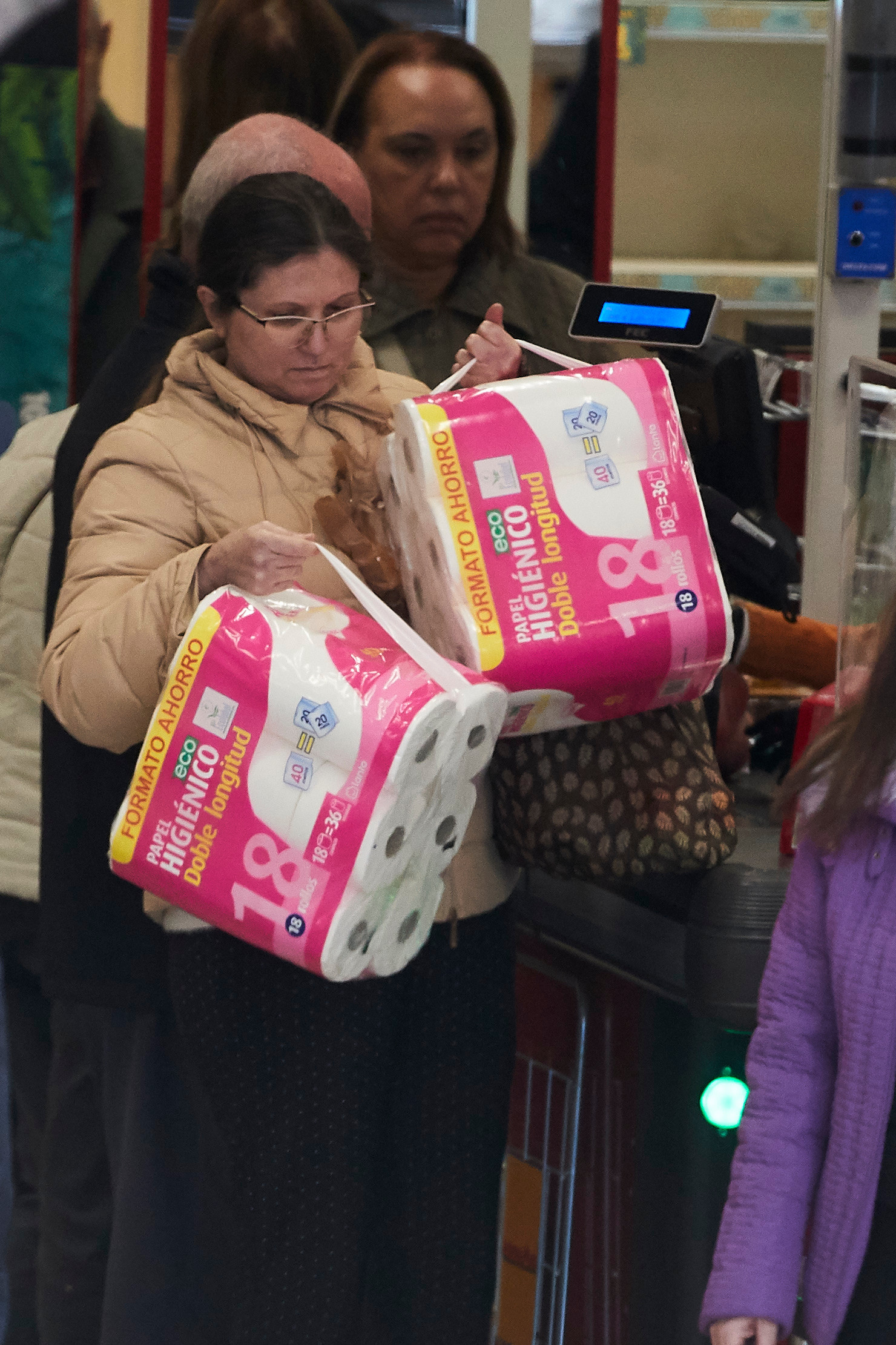  A shopper buys multipacks of toilet paper