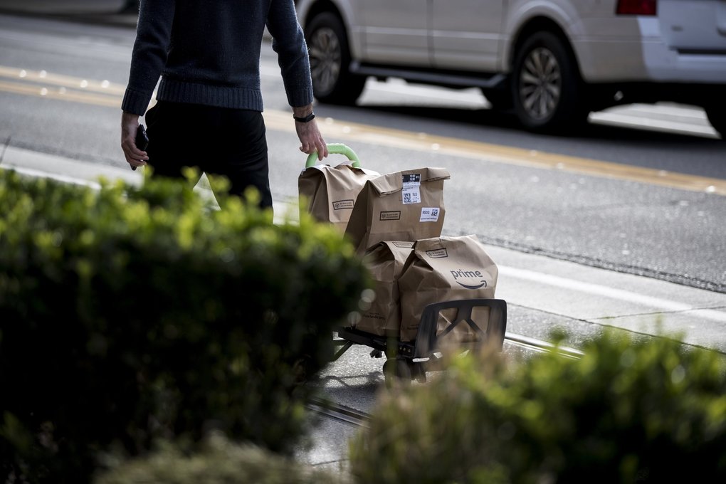 Amazon packages are delivered near the company’s downtown Seattle campus in February. (Amanda Snyder / The Seattle Times)