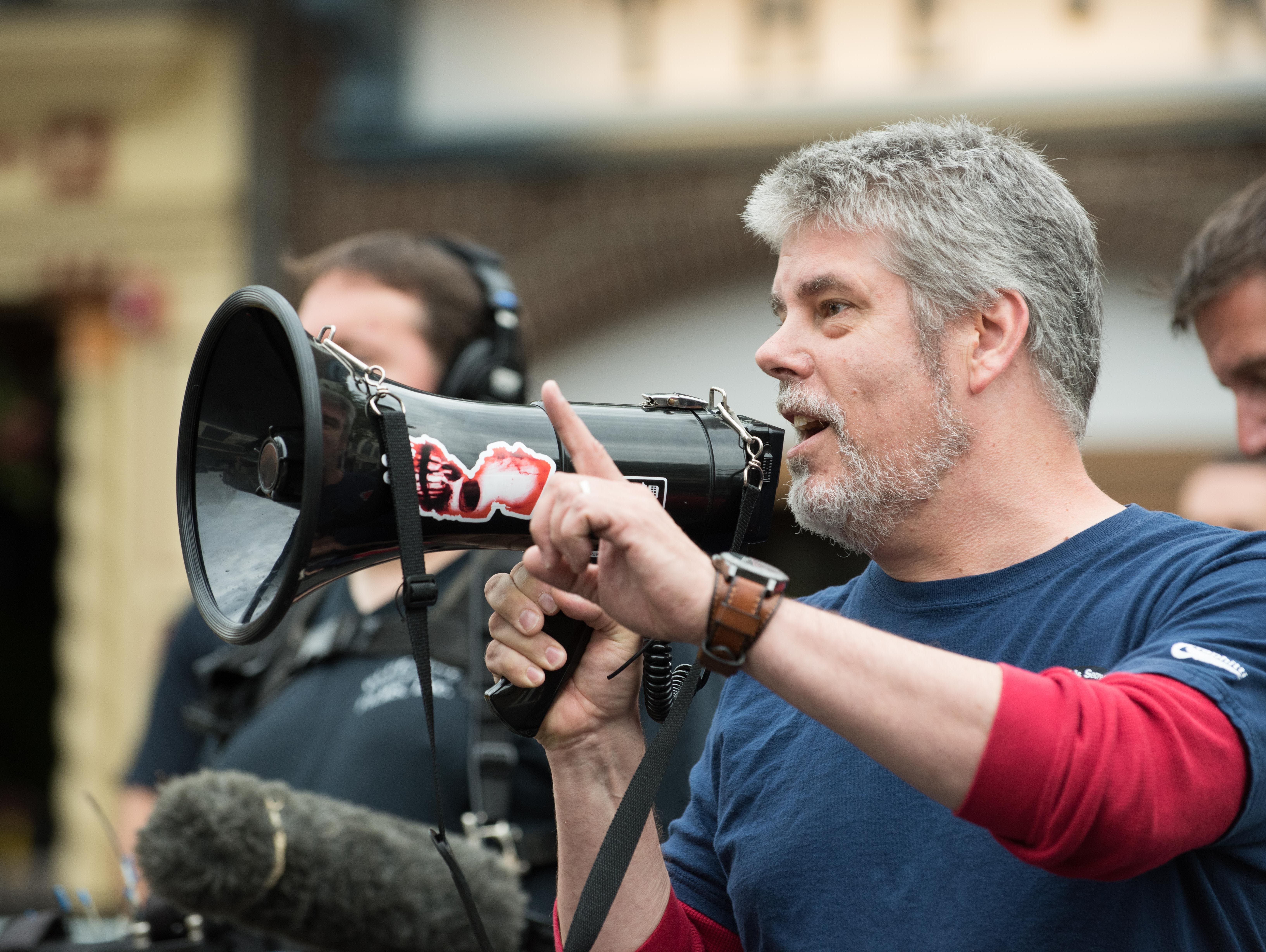 Michael Zapcic , from Comic Book Men, thanks fans as they line up along Broad and Mechanic streets in Red Bank to set a Guinness world record for the largest gathering of  Jays and Silent Bobs and celebrate the 20th anniversary of Jay and Silent Bob's Secret Stash Comic Book Store. AMC was filming the episode for "Comic Book Men."