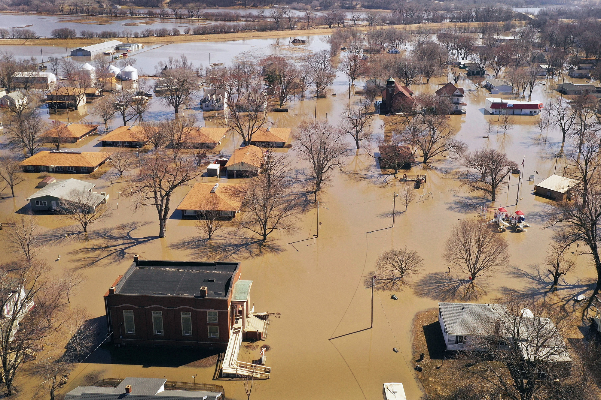 HAMBURG, IOWA - MARCH 20: Homes and businesses are surrounded by floodwater on March 20, 2019 in Hamburg, Iowa. Several Midwest states are battling some of the worst flooding they have experienced in decades as rain and snow melt from the recent "bomb cyclone" has inundated rivers and streams. At least three deaths have been linked to the flooding. (Photo by Scott Olson/Getty Images)