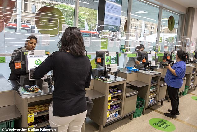Earlier this week, Woolworths installed protective screens at checkouts as an additional safeguard for Woolworths staff and shoppers. Pictured are the new screens at the Town Hall store in Sydney's CBD