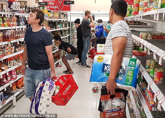 Large queues of people line up at Coles and panic buy due to government forcing business closures due to the coronavirus outbreak