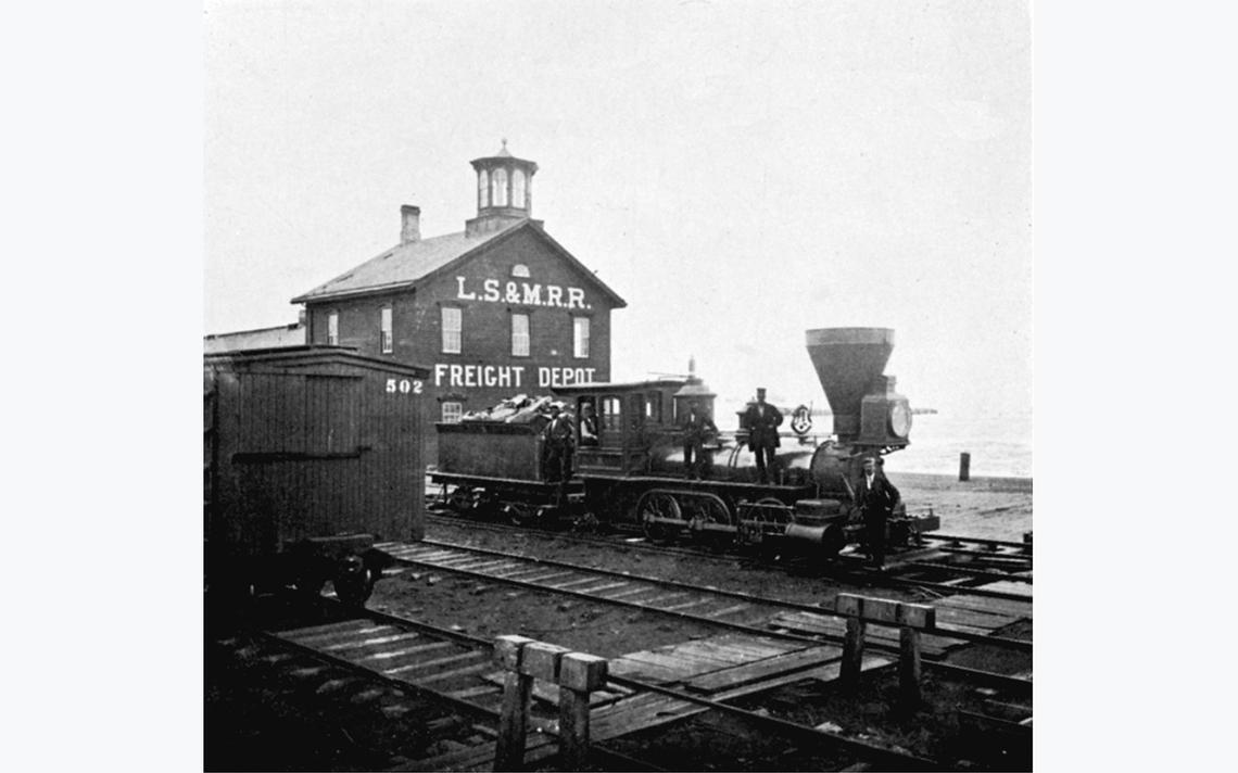 Employees of the Lake Superior & Mississippi Railroad pose with a locomotive outside the LS&M’s Freight Depot at the foot of Third Avenue East, ca. 1870. (Photo courtesy of the Minnesota Historical Society)