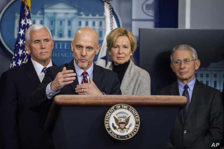U.S. Food and Drug Administration Commissioner Stephen Hahn, with, from left, Vice President Mike Pence, White House…