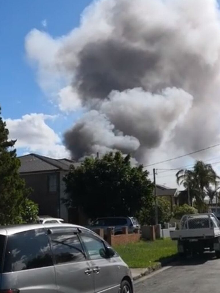 Smoke billowing from the factory.
