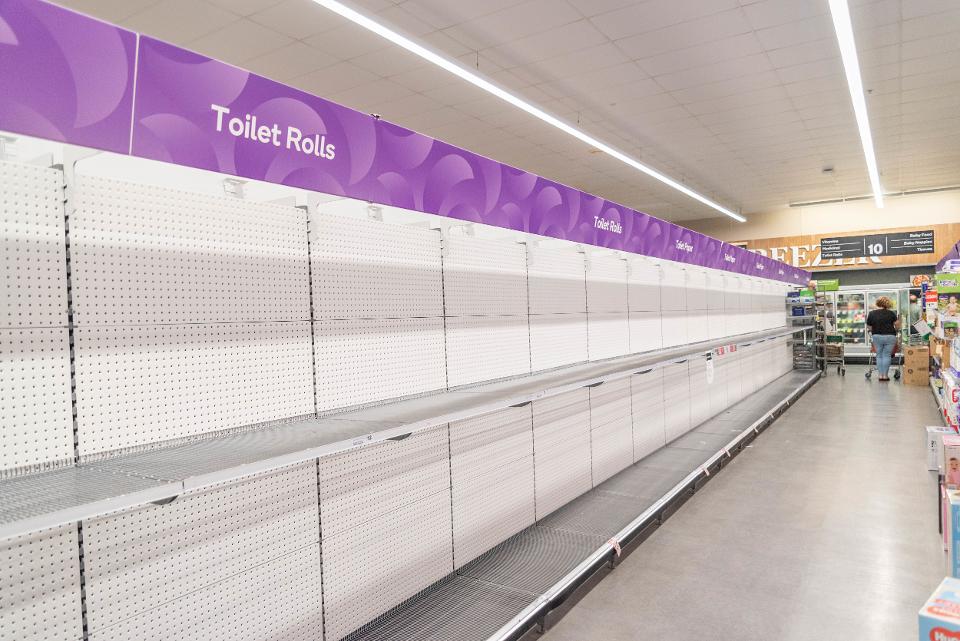 A view of Empty toilet roll shelves at a supermarket. Shops...