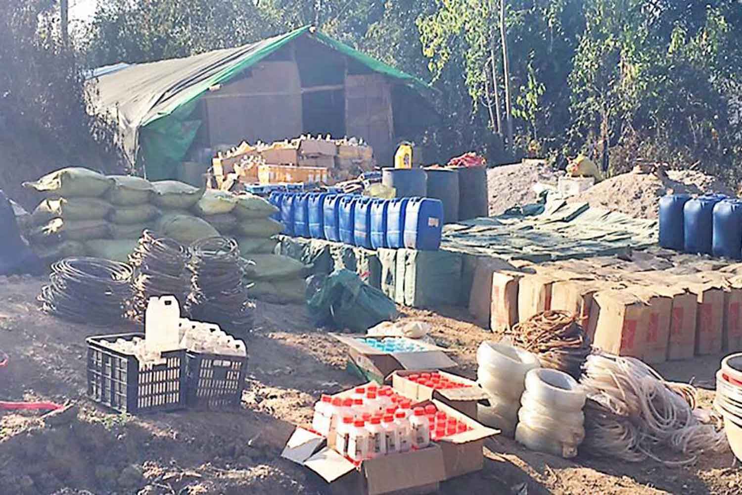 Some of the hundreds of containers of chemicals and precursors found at the plant in Kutkai township of the Shan State of Myanmar, raided by the Myanmar armed forces last Friday. (Photo supplied)