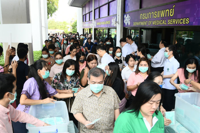 People line up to get a free packet of face masks at the Department of Medical Services in Nonthaburi province on March 3, 2020. People line up to get a free packet of face masks at the Department of Medical Services in Nonthaburi province on March 3, 2020.