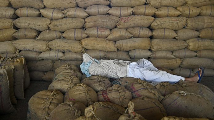 Latest news on farmers | ThePrint A farmer rests in a wholesale market (Representational image)