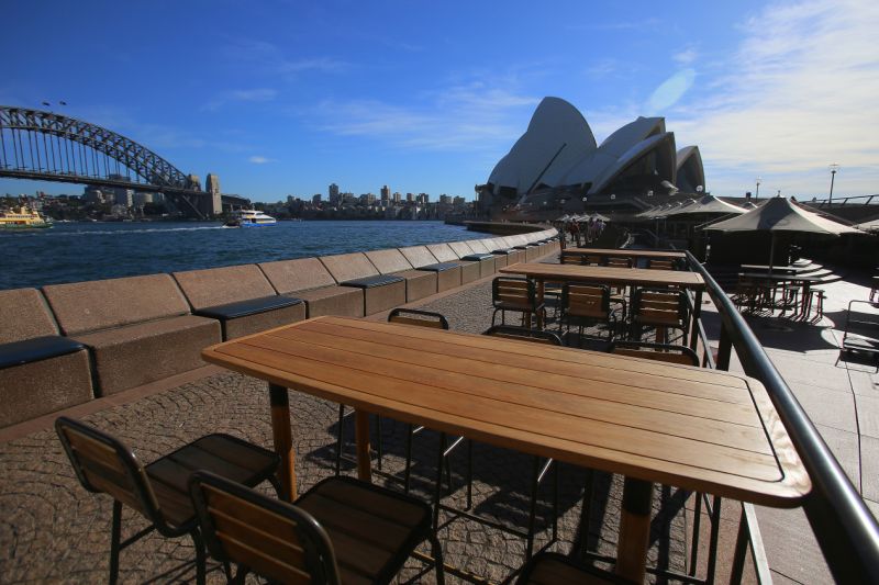 Empty tables at Sydney's famous Opera Bar as the state prepared to enforce a comprehensive shutdown. Source: Getty Images