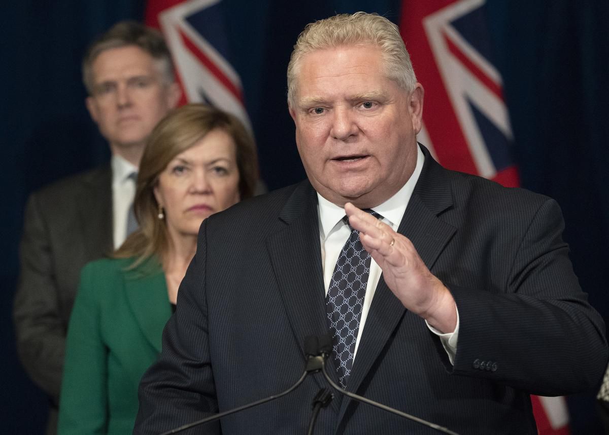 Ontario Premier Doug Ford answers questions as Health Minister Christine Elliott and Finance Minister Rod Phillips listen at Queen's Park in Toronto on Monday, March 23, 2020.