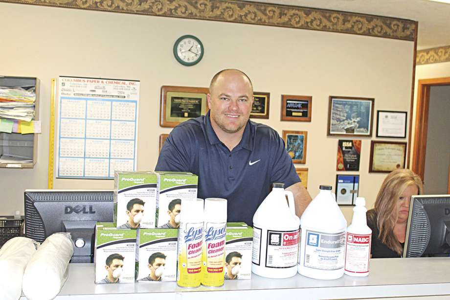 E.J. Nolen stands behind a product display at Columbus Paper and Chemical on Military Road on Friday, March 13, 2020. The sales representative is also the third generation to be involved in the family business that started in 1967. Since the COVID-19 coronavirus outbreak came to the U.S., requests for hand sanitizer, disinfectant and toilet paper has skyrocketed for the janitorial supplies wholesaler, Nolen said. "It's just nonstop," he said. (Zack Plair/The Commercial Dispatch via AP) Photo: Zack Plair, AP / The Commercial Dispatch